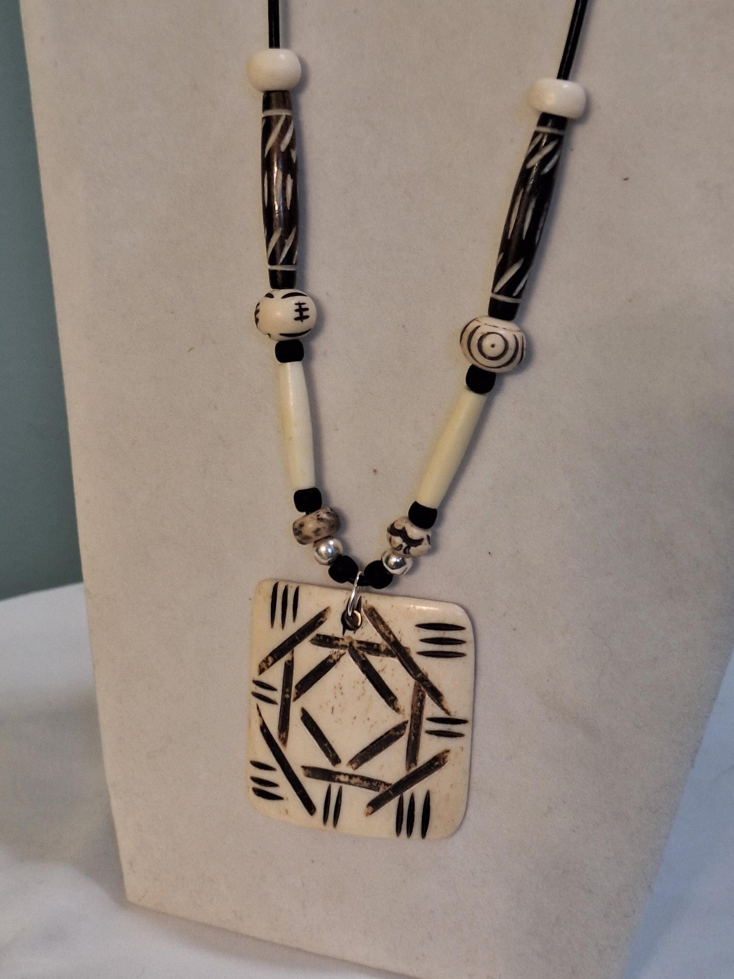 African Art Pendant  necklace, Buffalo bone beads hand carved and painted.