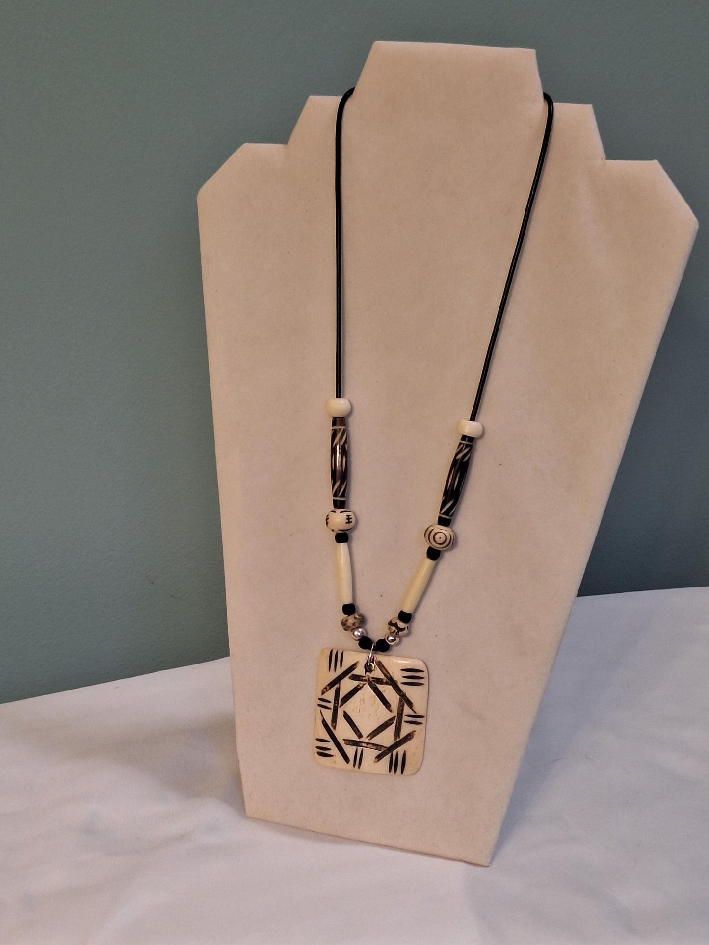 African Art Pendant  necklace, Buffalo bone beads hand carved and painted.